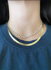 Herringbone gold chain necklace styled with diamond choker necklace