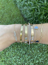 styled wrist stack vasilea diamonds gold cartier van cleef